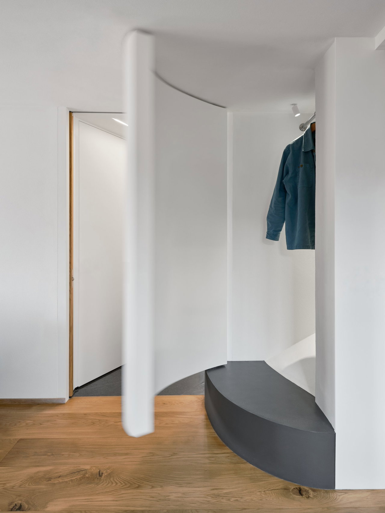 Wooden pivot door in a private home in Stockholm with FritsJurgens System M+ pivot hinge system inside