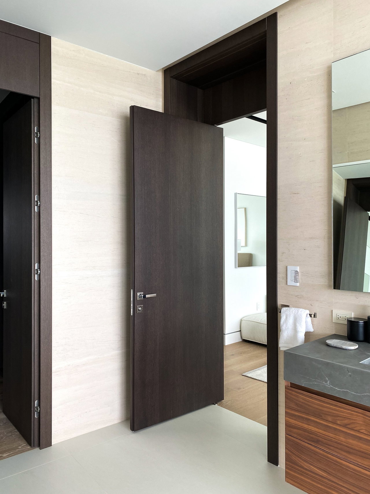 Wooden pivot door in a private home in Miami with FritsJurgens System One pivot hinge system inside