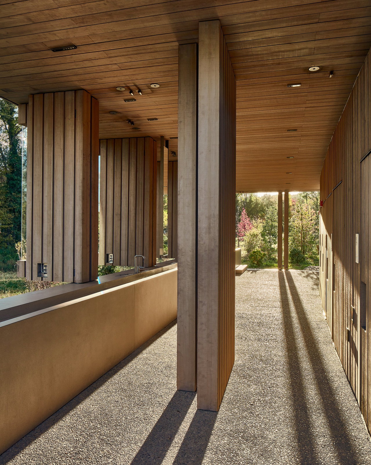 Wooden pivot door in a public building in New Windsor with FritsJurgens System One pivot hinge system inside