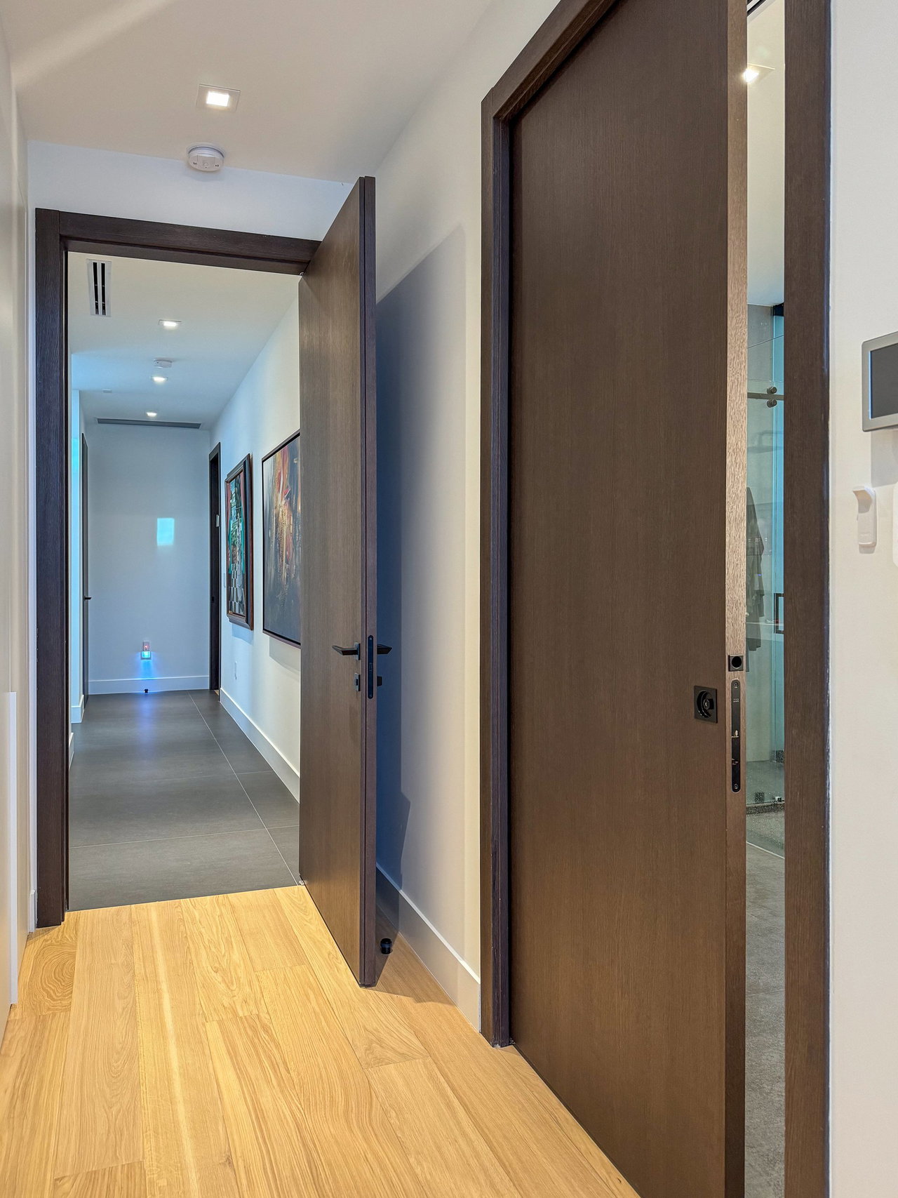 Wooden pivot door in a private home in North Miami Beach with FritsJurgens System One pivot hinge system inside