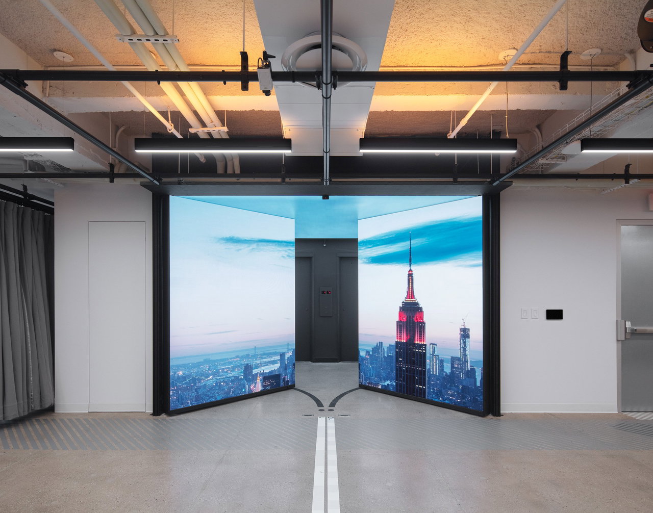 Pivot door in an office in New York City with FritsJurgens System One pivot hinge system inside