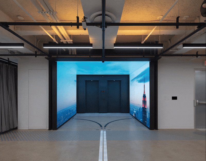 Pivot door in an office in New York City with FritsJurgens System One pivot hinge system inside