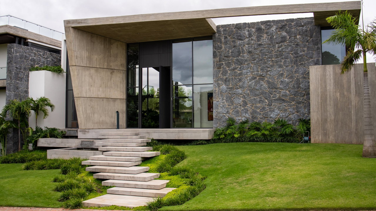 Stone pivot door in a private home in Santa Cruz de la Sierra with FritsJurgens System M+ pivot hinge system inside
