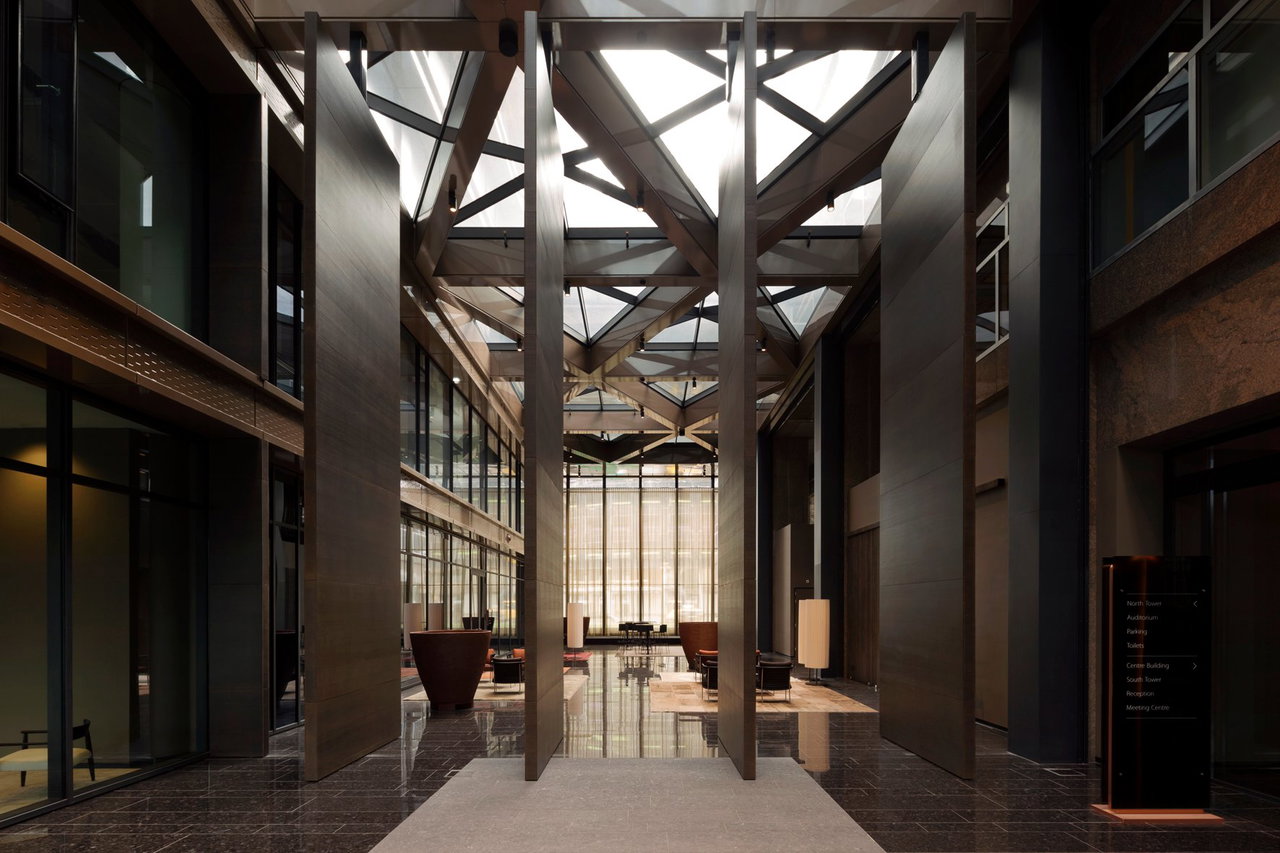 Wooden pivot door in an office in Amsterdam with FritsJurgens System 3 pivot hinge system inside