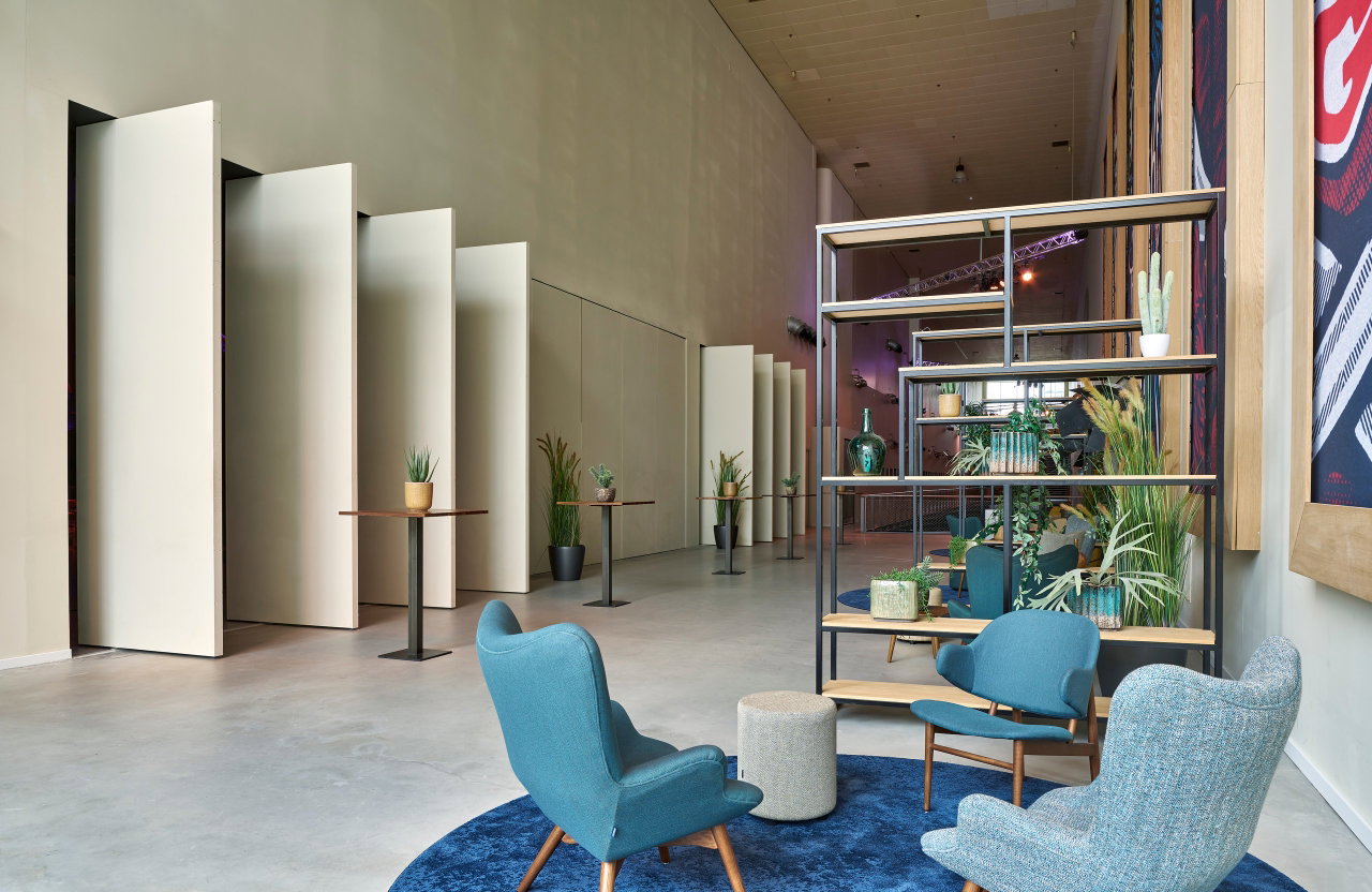 Wooden pivot door in a public building in Amsterdam with FritsJurgens System M pivot hinge system inside