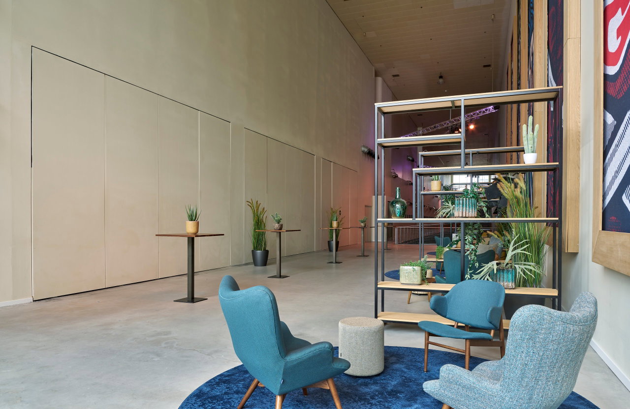 Wooden pivot door in a public building in Amsterdam with FritsJurgens System M pivot hinge system inside