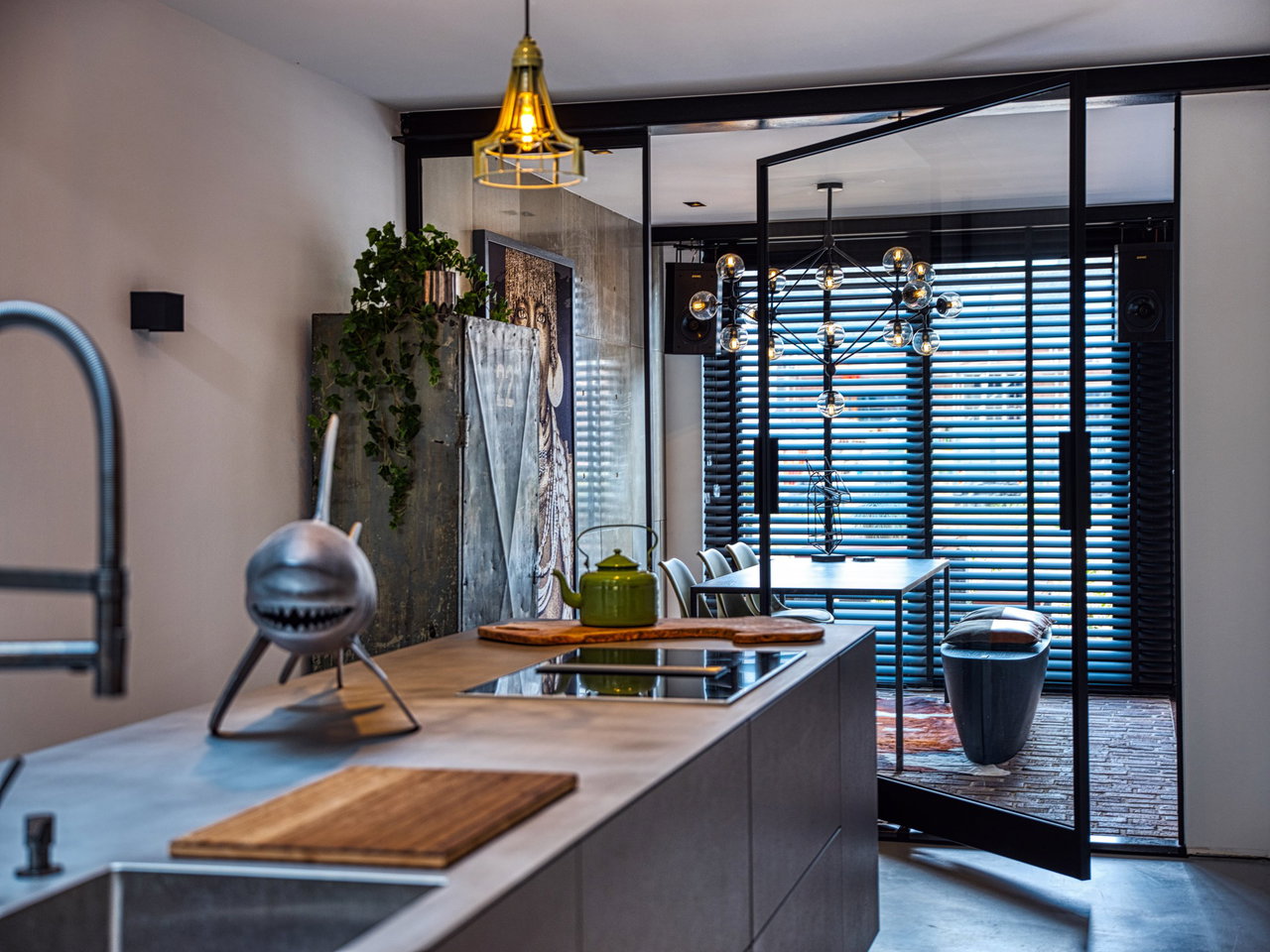 Steel and glass pivot door in a private home in Ede with FritsJurgens System 3 pivot hinge system inside