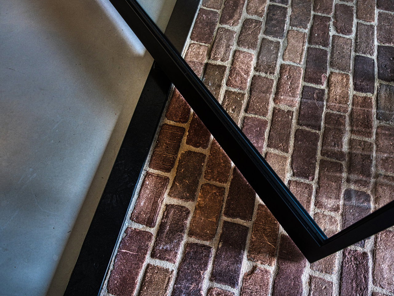 Steel and glass pivot door in a private home in Ede with FritsJurgens System 3 pivot hinge system inside