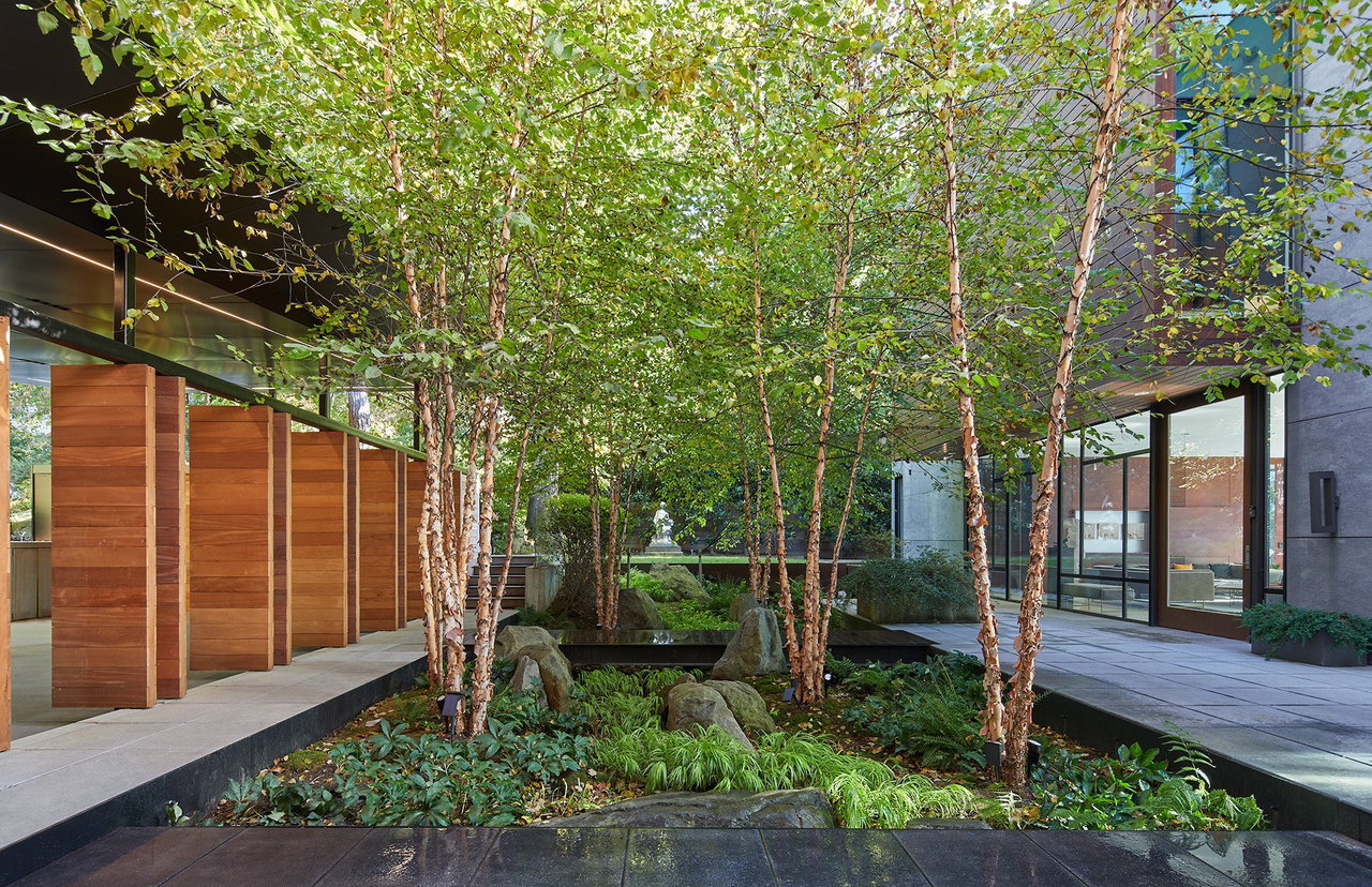 Wooden pivot door in a private home in Bethesda with FritsJurgens System One pivot hinge system inside