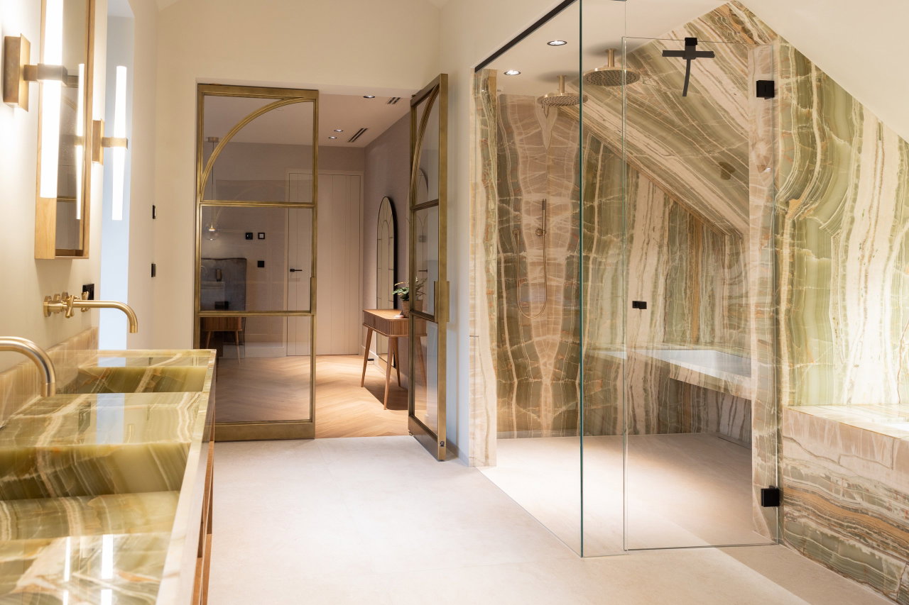 Steel and glass pivot door in a private home in Huizen with FritsJurgens System M pivot hinge system inside