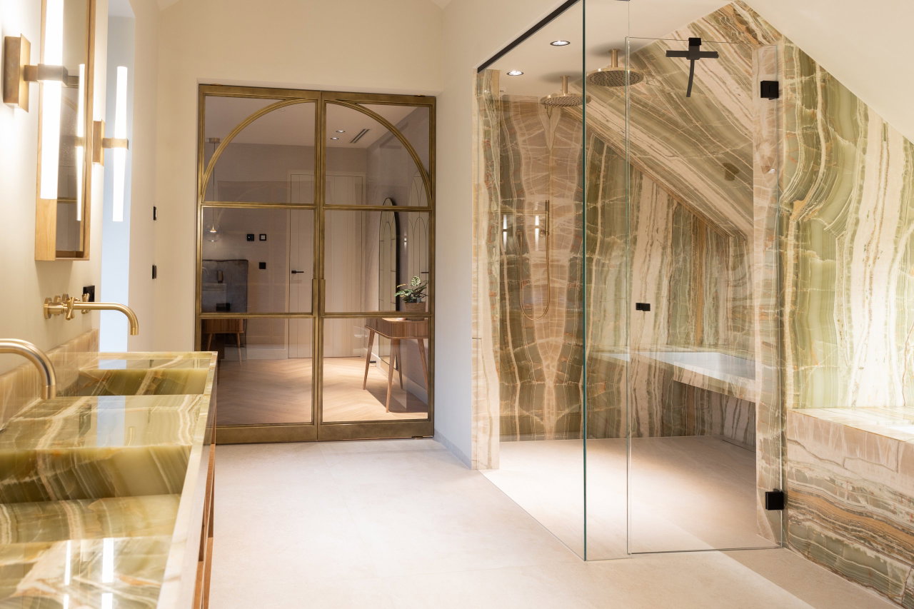 Steel and glass pivot door in a private home in Huizen with FritsJurgens System M pivot hinge system inside