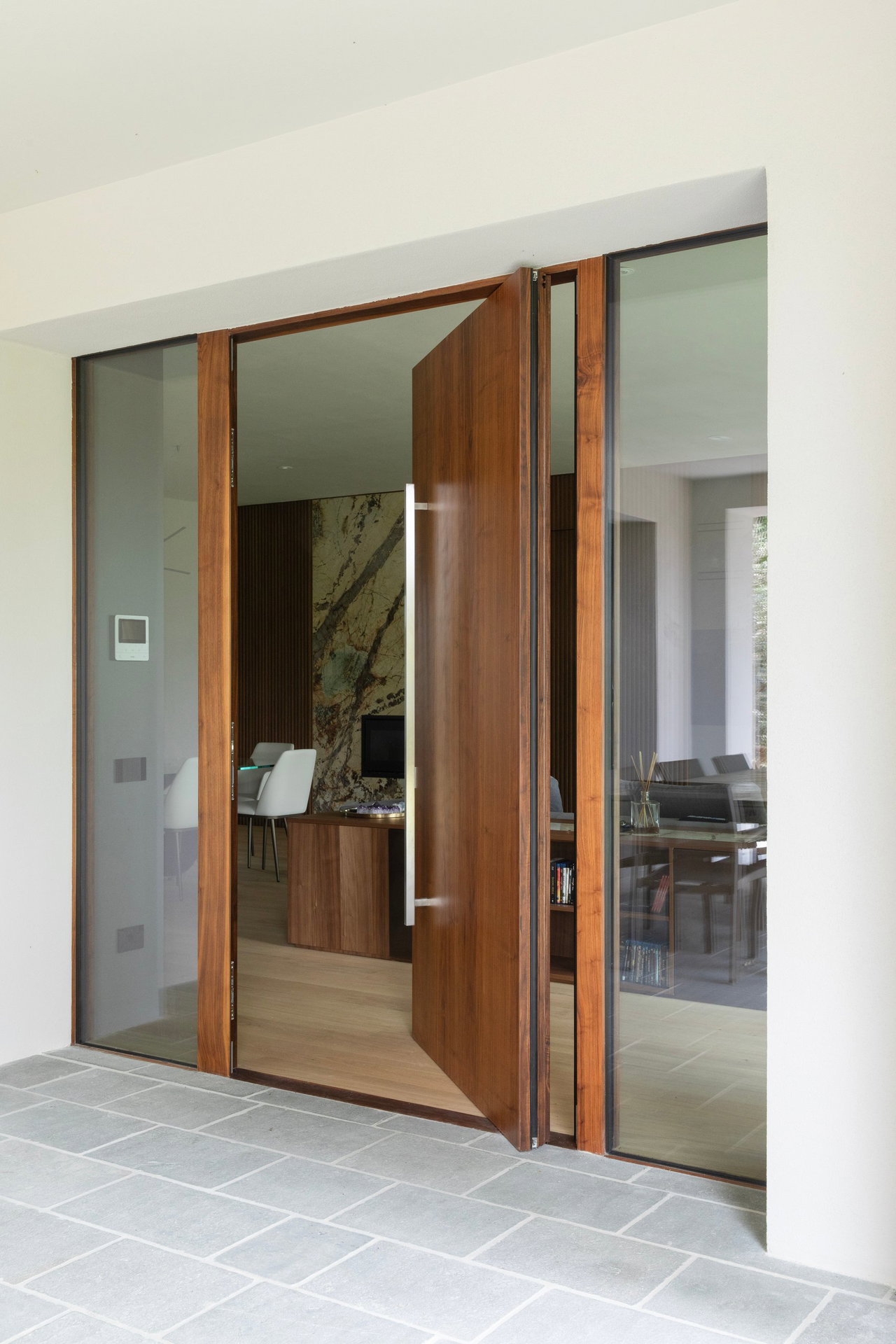 Wooden pivot door in a private home in Modena with FritsJurgens System One pivot hinge system inside
