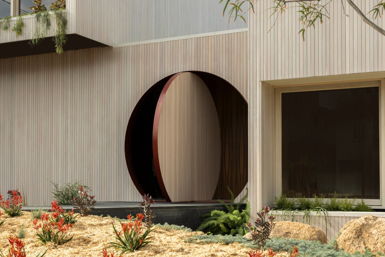 Wooden pivot door in a private home in Brisbane with FritsJurgens System 3 pivot hinge system inside