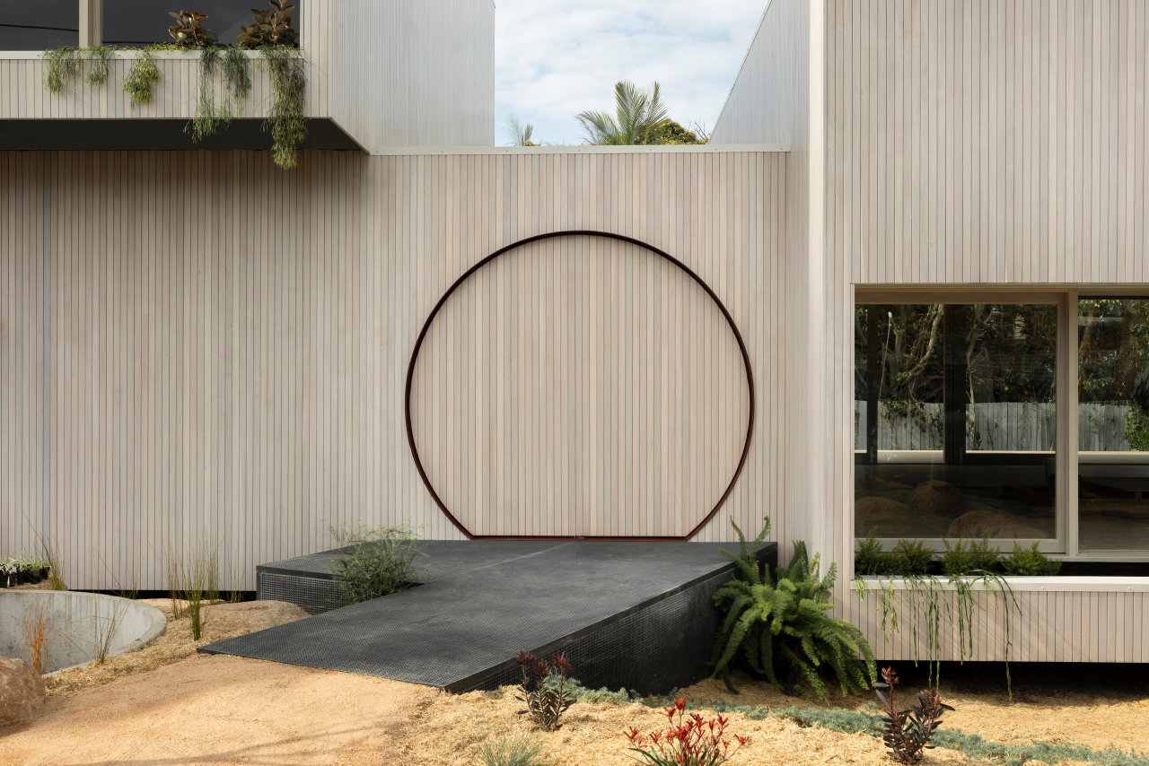 Wooden pivot door in a private home in Brisbane with FritsJurgens System 3 pivot hinge system inside