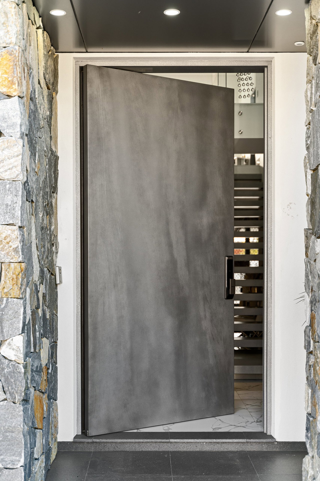 Pivot door in a private home in Sydney with FritsJurgens System M+ pivot hinge system inside