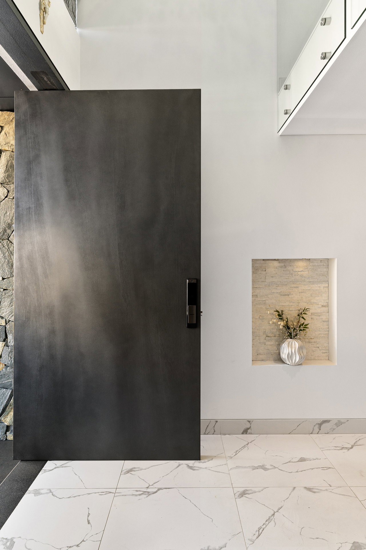 Pivot door in a private home in Sydney with FritsJurgens System M+ pivot hinge system inside