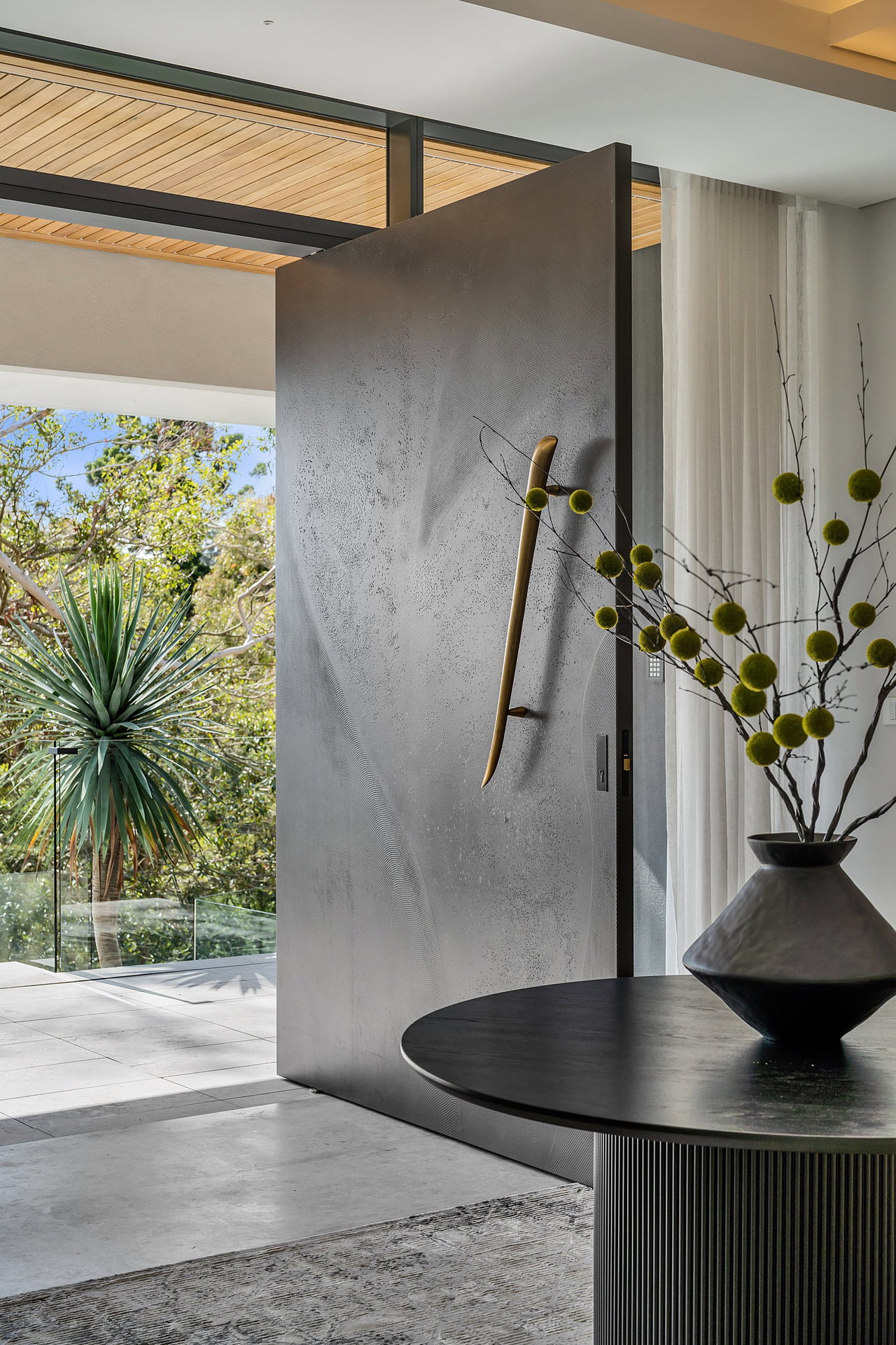Pivot door in a private home in Sydney with FritsJurgens System M+ pivot hinge system inside