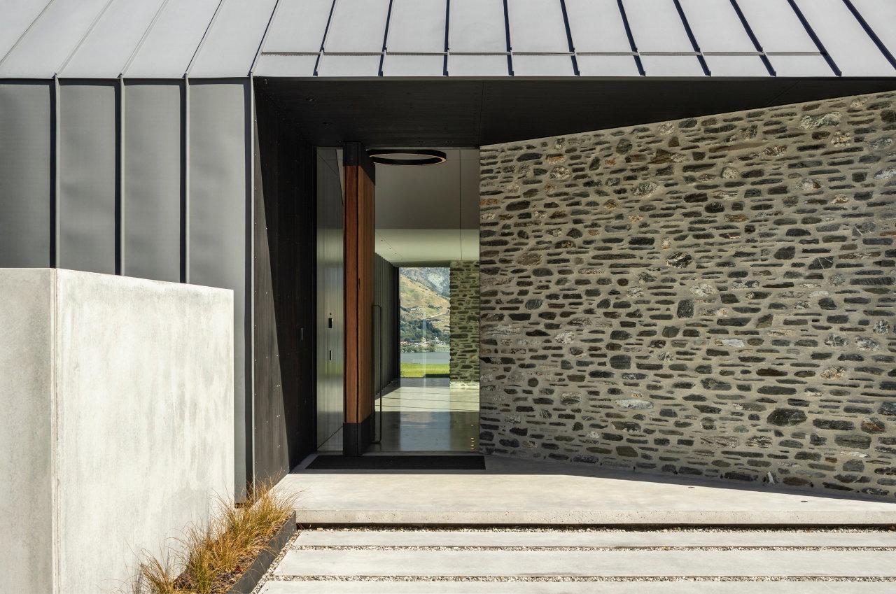 Wooden pivot door in a private home in Queenstown with FritsJurgens System M+ pivot hinge system inside