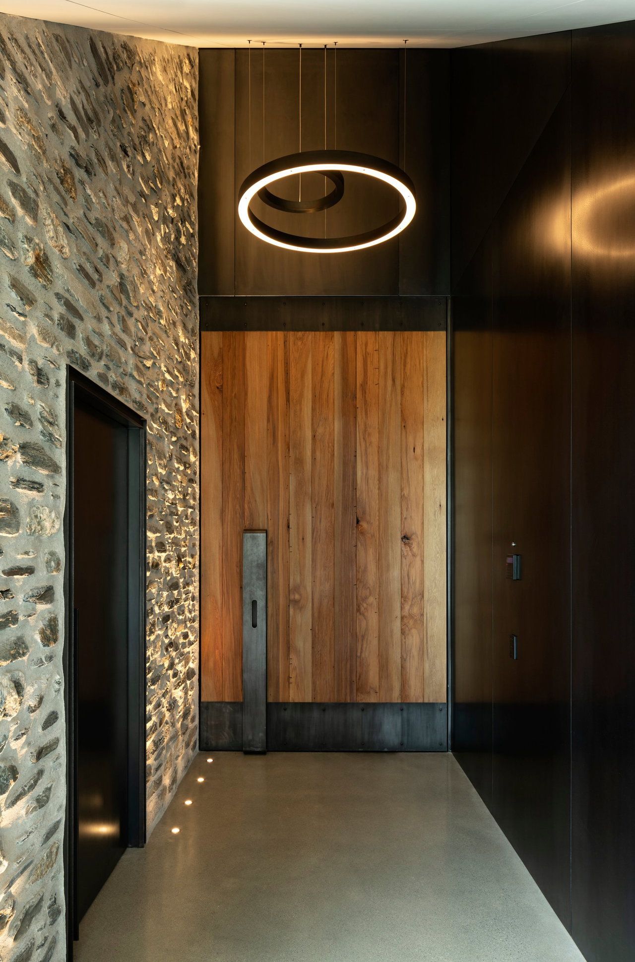Wooden pivot door in a private home in Queenstown with FritsJurgens System M+ pivot hinge system inside
