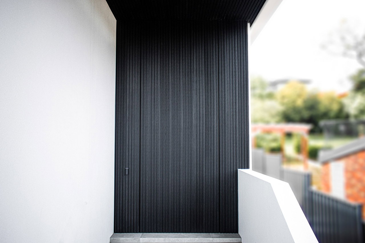 Composite pivot door in a private home in Melbourne with FritsJurgens System M+ pivot hinge system inside