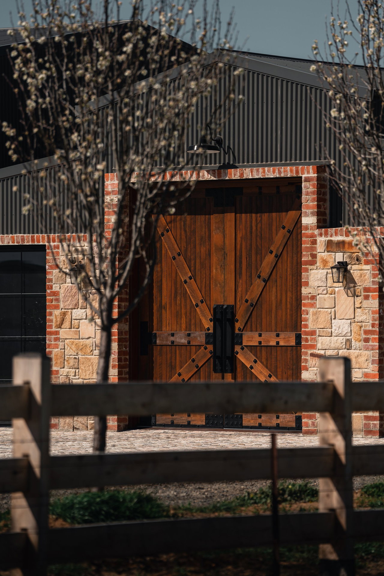 Wooden pivot door in a commercial building in Canberra with FritsJurgens System M+ pivot hinge system inside