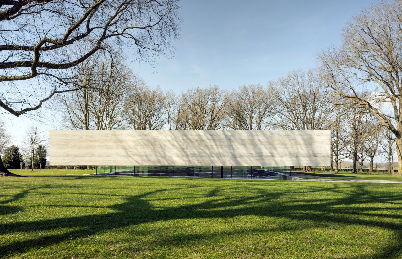 Steel and glass pivot door at a public site in Margraten with FritsJurgens System M+ pivot hinge system inside