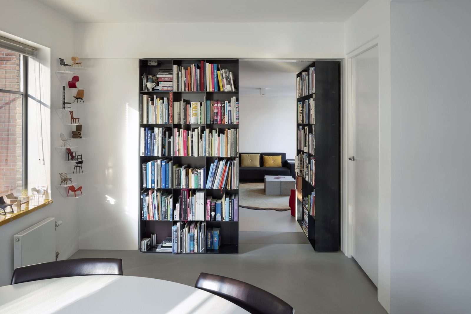 Secret pivoting bookcase with FritsJurgens pivot hinge system - right door opened.