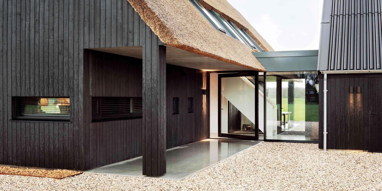 Exterior pivot door with FritsJurgens Inside.