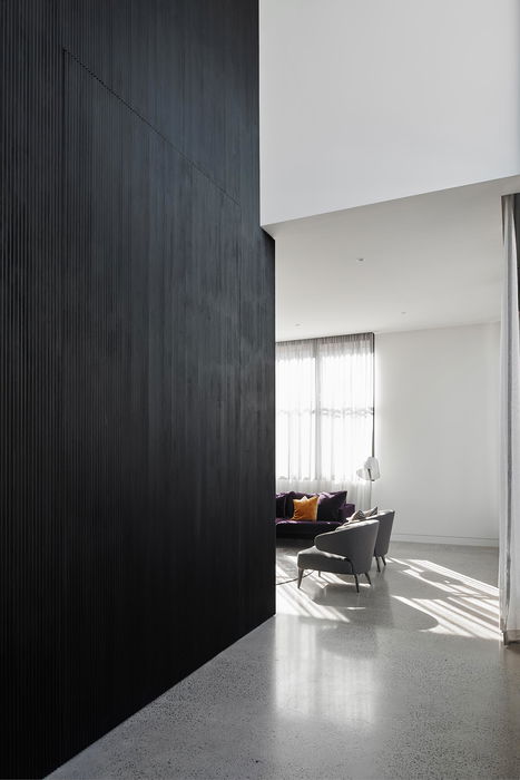 Black oversized door with wooden slats 2 - FritsJurgens pivot hinges Inside