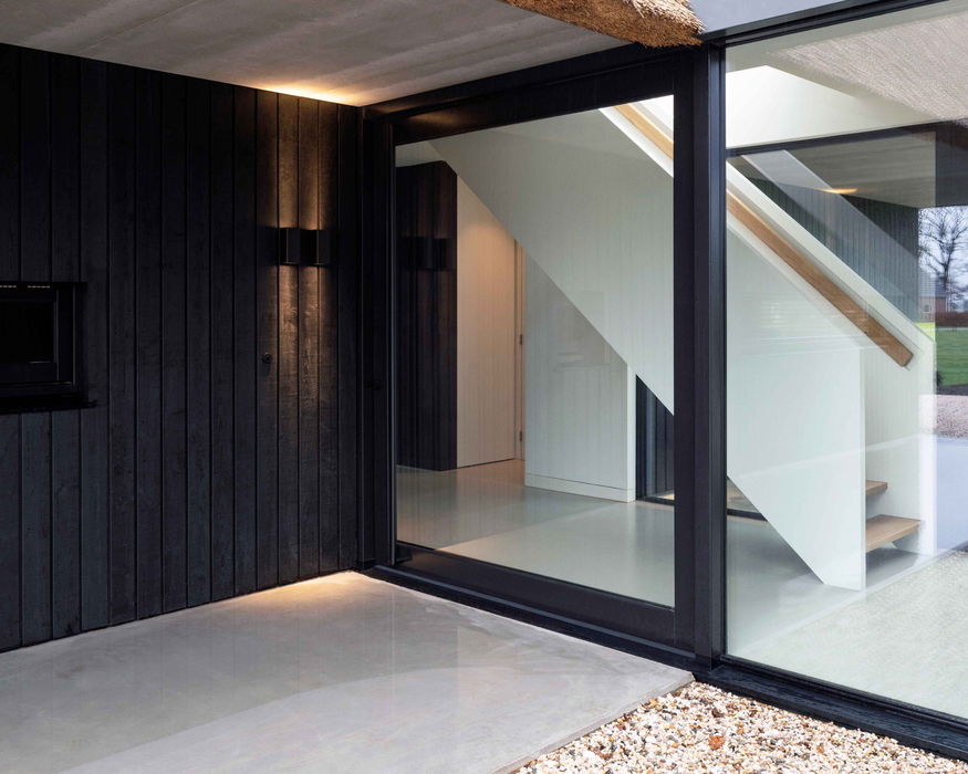 Exterior pivot door with FritsJurgens System M inside- FritsJurgens