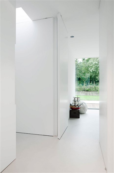Clean wooden pivot doors in modern home – FritsJurgens pivot hinges Inside 1