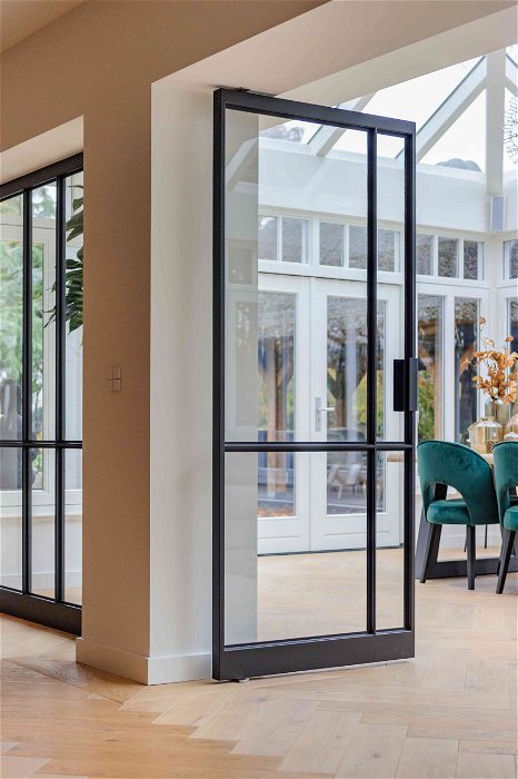 Multiple glass and steel pivot doors designed by Preferro - FritsJurgens pivot hinges Inside