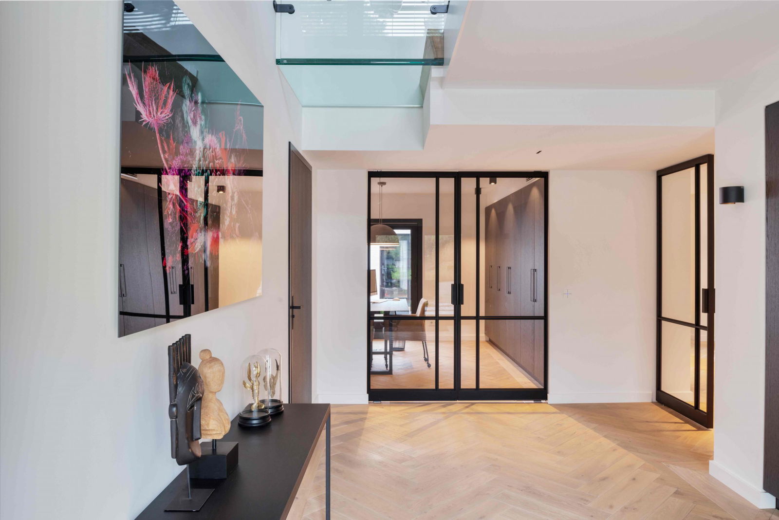 Multiple glass and steel pivot doors designed by Preferro - FritsJurgens pivot hinges Inside.