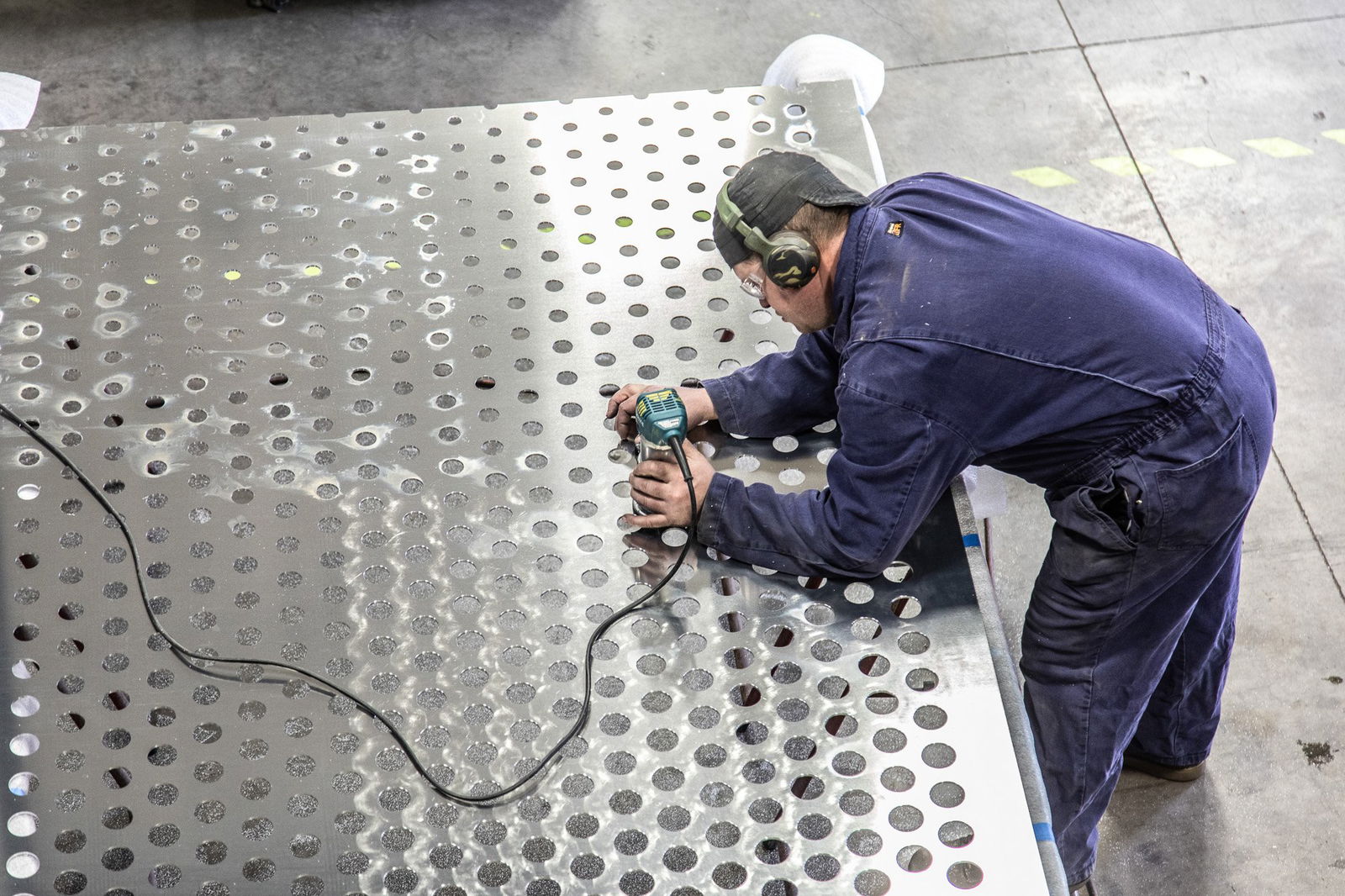 Aluminum pivot door fabrication with FritsJurgens pivot hinges inside.